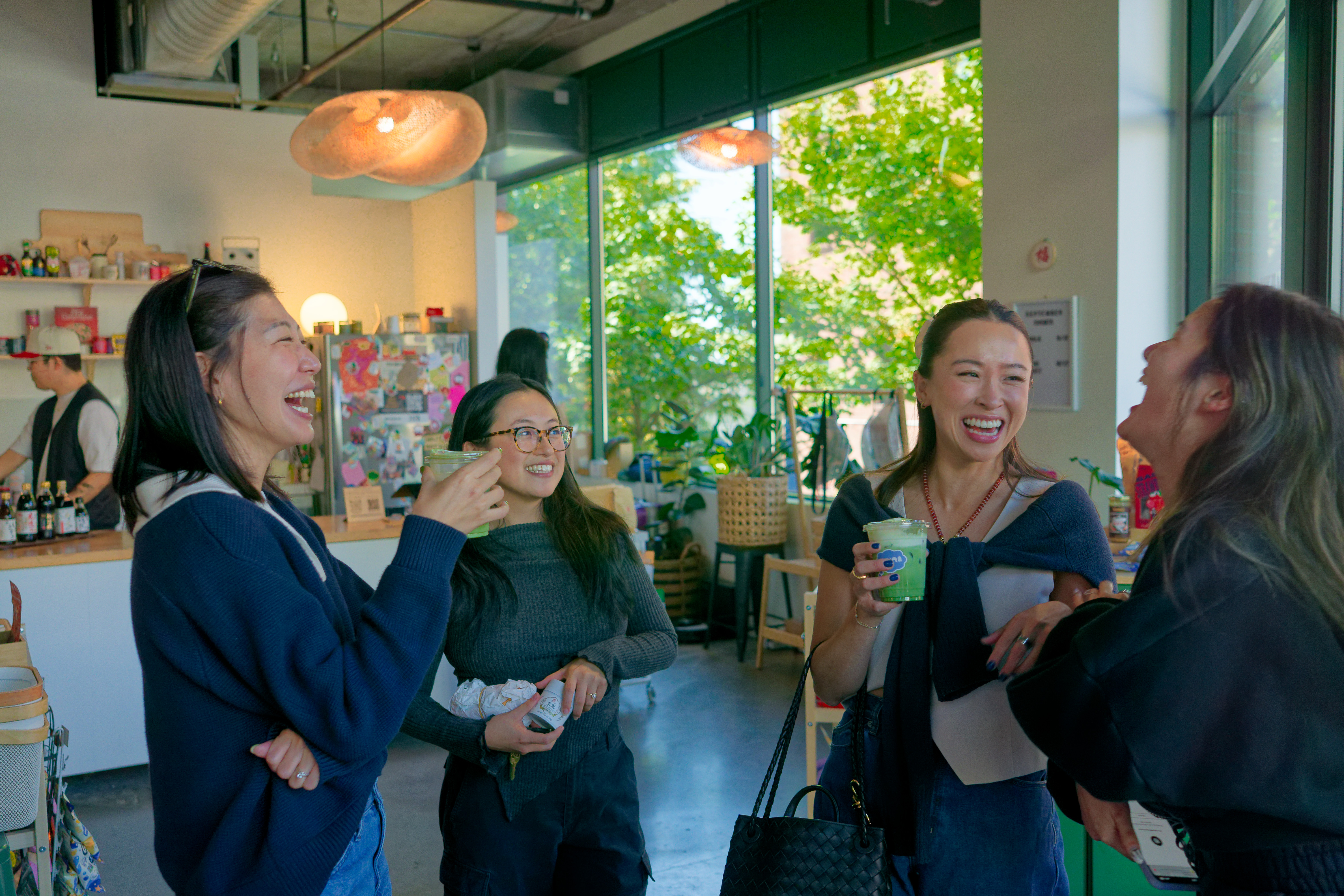 People enjoying Muni Cafe beverages at a Seattle event